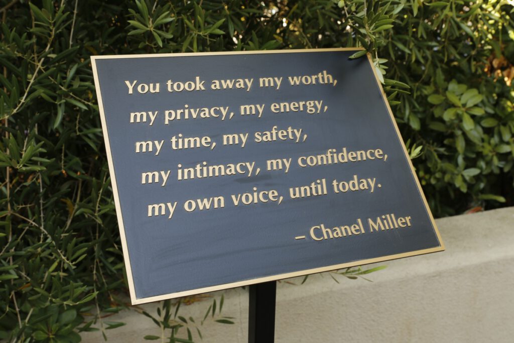 A plaque quoting Chanel Miller saying, "You took away my worth, my privacy, my energy, my time, my safety, my intimacy, my confidence, my own voice, until today."